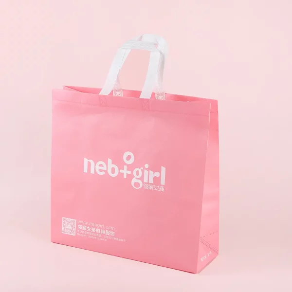 Pink reusable nonwoven shopping bag with white handle