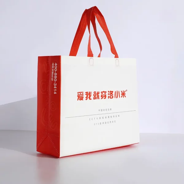 Branded clothing packaging nonwoven bag with red straps